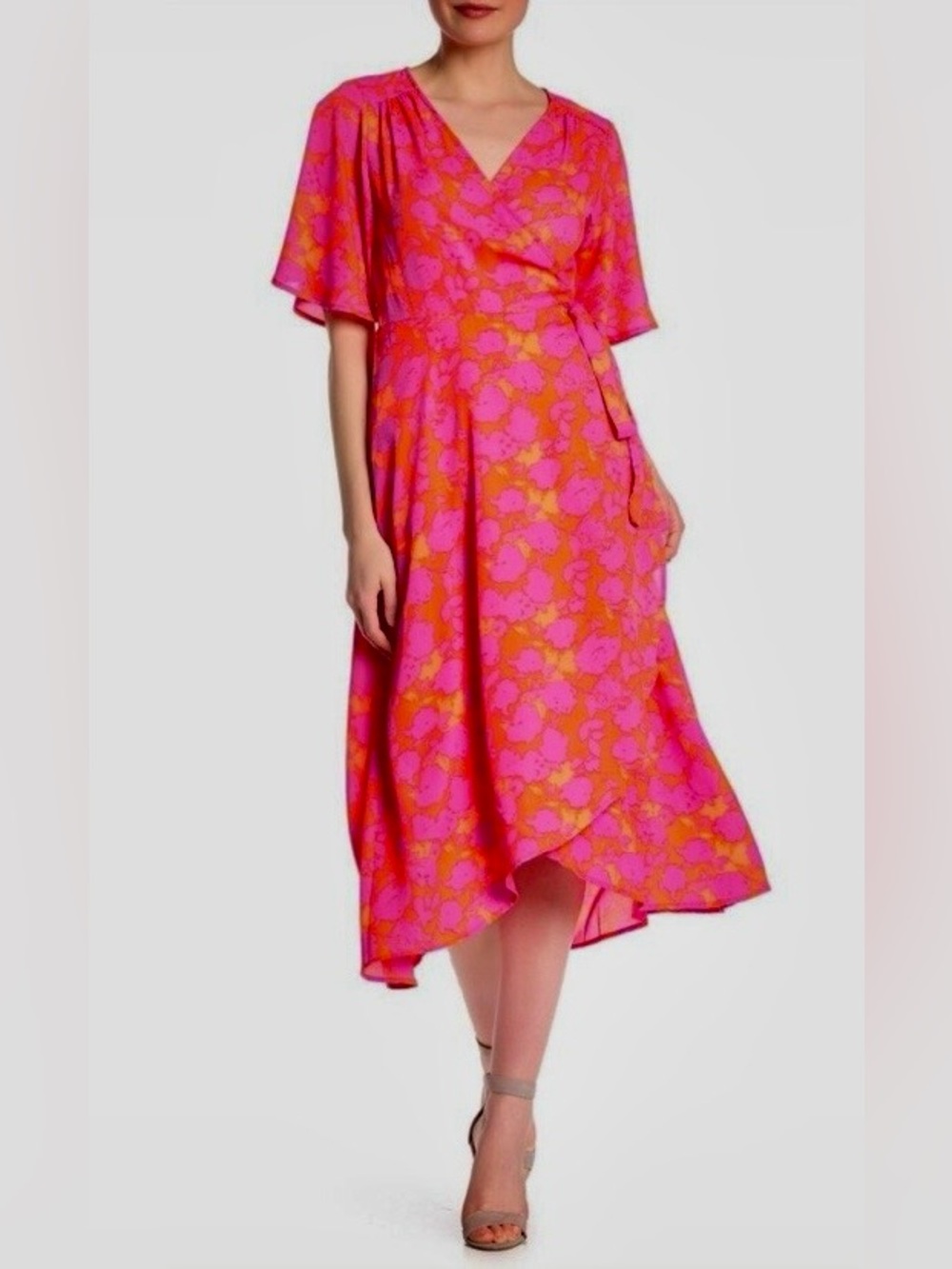 Bobeau Orna Wrap Dress in a vibrant pink and orange/red flowy midi hem